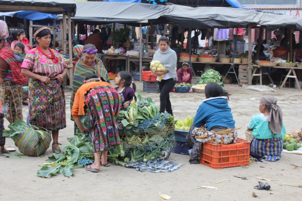 IMG_5476 Market in Guatemala: note the young girl in the center forming part of the sales-team